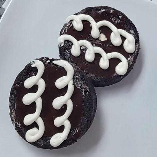 Dark Chocolate Cookies with white squiggly icing lines on top
